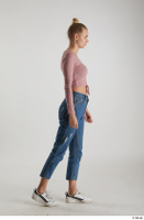  Kate Jones  1 blue jeans casual dressed pink long sleeve t shirt side view walking white sneakers whole body 0005.jpg